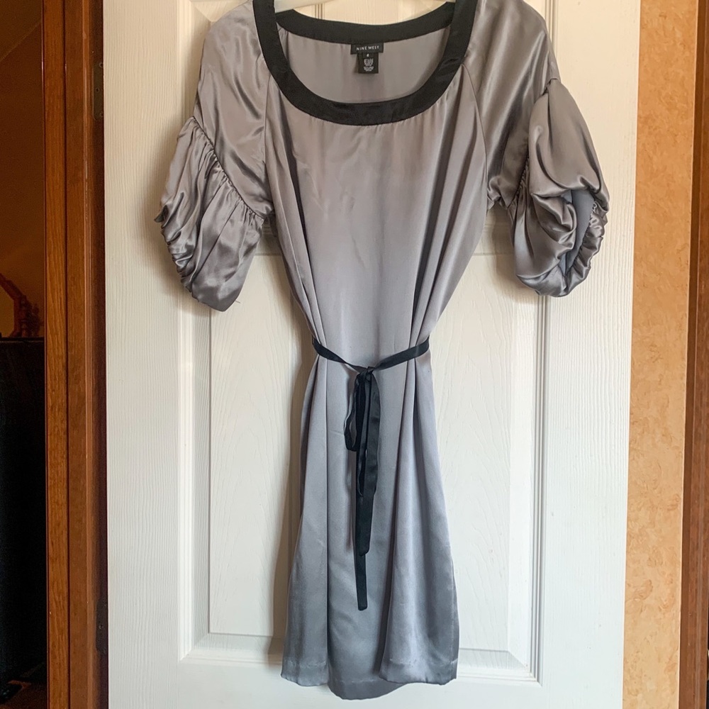 Silk gray dress with blouson sleeves.